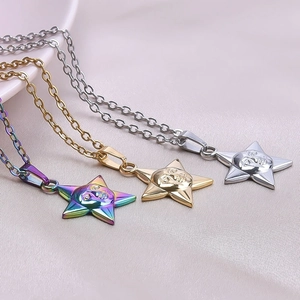 Detailed macro of 18k plated stainless steel star pendant necklaces in gold, silver and rainbow