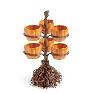 Detail of Halloween snack stand with resin broomstick base and six pumpkin-shaped bowls