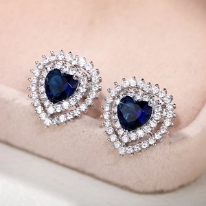 Elegant heart-shaped stud earrings with dark blue zircon and white crystal halo
