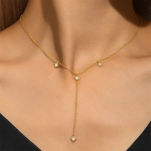 Close-up of 925 silver Y-shaped long necklace with sparkling star pendants on model
