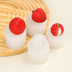 Close-up of litchi silicone molds on a wooden tray with realistic fruit replicas