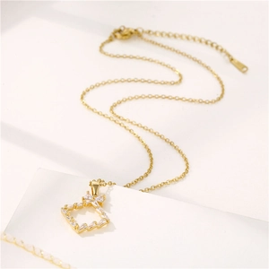 Gold stainless steel chain necklace with a square clear gemstone pendant on white background