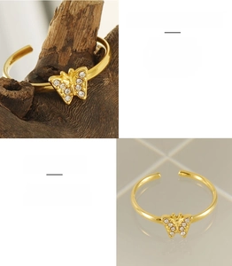 Detailed macro view of 18K gold-plated stainless steel butterfly ring with zircon stones