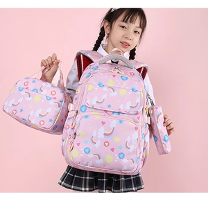 Three-piece pink school bag set for girls featuring rainbow and cloud prints with lunch bag