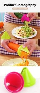 Close-up of pink and green vegetable spiralizer blades for carrot and cucumber slicing
