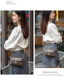 Detail of coffee brown chain bag with quilted embroidery and gold pearl clasp on model