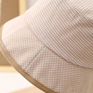 Japanese style checkered bucket hat with brown leather trim edge and woven texture fabric