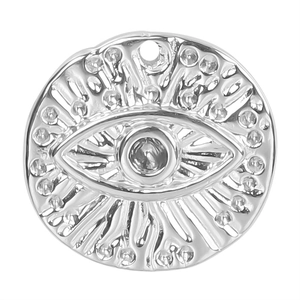 Macro detail of silver stainless steel evil eye pendant with refined embossed texture