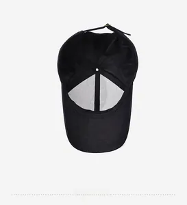 Detailed view of the mesh lining and adjustable metal buckle inside a black baseball cap