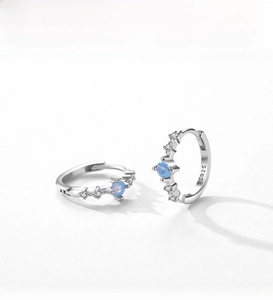 Detailed view of S925 sterling silver hoop earrings with blue opal and zirconia