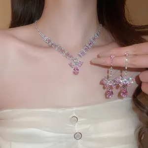 Pink zircon waterdrop jewelry set with necklace and drop earrings in a bow design