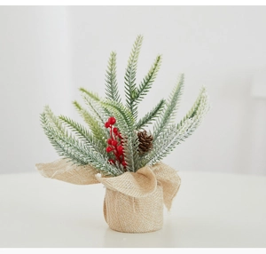 Mini tabletop artificial Christmas tree with red berries, pinecone and burlap base