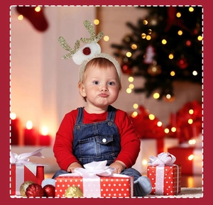 Detail of Christmas reindeer antler headband with gold sequins and white plush balls