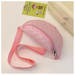 Detail of pink quilted chest bag for kids featuring diamond stitching and adjustable strap