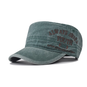 Detail of vintage washed army cap featuring embroidered Youth 1995 lettering on side