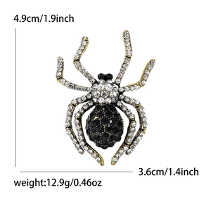 Vintage gold alloy spider brooch with crystal rhinestones and sizing metrics