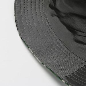 Macro shot of reinforced stitching and breathable honeycomb lining on this bucket hat