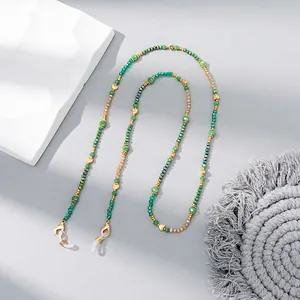 Fashionable crystal beaded glasses chain with gold heart charms and green faceted beads