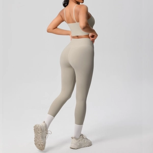 Side view of taupe yoga set showing high-waist leggings and thin strap sports bra