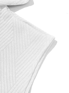 Close-up of premium white sleeveless hoodie fabric showing high-quality twill texture