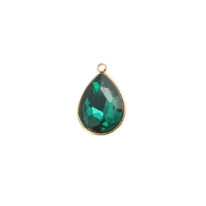 Detail view of water-drop shaped green gemstone pendant with gold-plated bezel setting