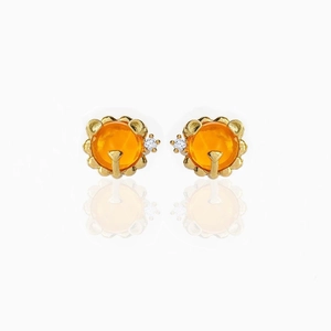 Detail of 18K gold plated stud earrings with orange zircon and white side stone