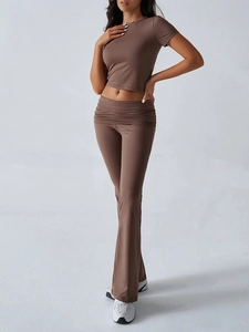 Detail of brown short sleeve crop top and matching high waisted flared pants set