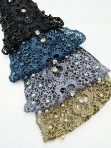 Detailed view of handmade lace headbands with pearls and crystals in four elegant colors