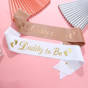 Glittery rose gold and white Daddy to Be sashes for baby shower party decorations