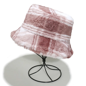 Detail of pink and white plaid faux fur bucket hat on a display stand