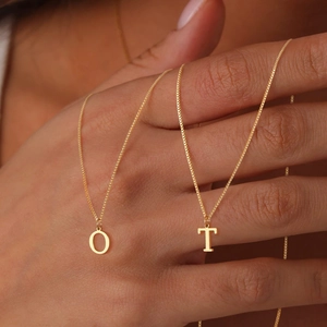 Minimalist gold stainless steel initial necklaces with O and T letter pendants on box chains