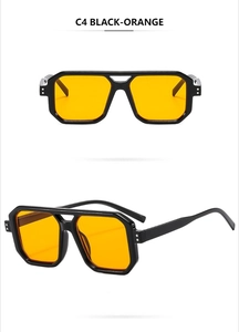 Detail view of double bridge aviator sunglasses with black frame and orange lenses