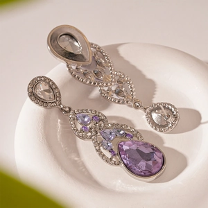Sparkling purple teardrop crystal earrings with micro-inlaid diamonds on a stone base