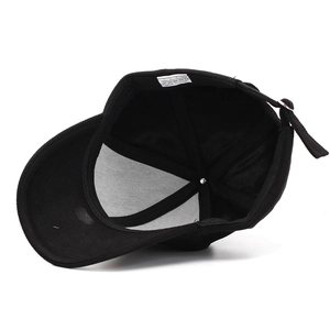 Detail view of 100% polyester baseball cap interior showing washing label and stitching