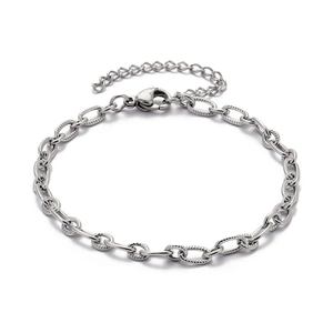 Detailed close-up of a silver textured paperclip chain bracelet with extension link