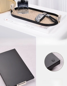 Detailed view of metal organizer tray with woven lining and non-slip bottom pads