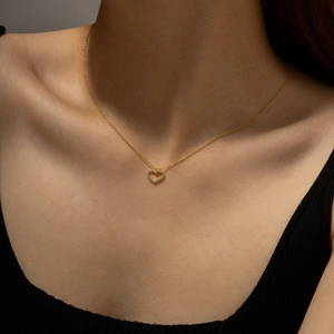 S925 sterling silver gold heart pendant necklace with shimmering zircon stones on a model