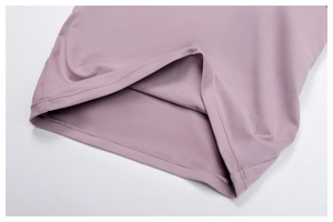 Close-up of fine double-needle stitching on lavender brushed yoga wear fabric hem