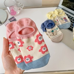 Close-up of low cut invisible cotton socks with floral jacquard and non-slip silicone grip