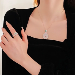 Luxury zircon and jade pendant necklace with ring set worn on a black velvet dress