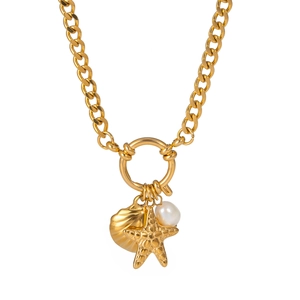 Close-up of golden starfish, sea shell, and pearl charms on a thick link chain necklace