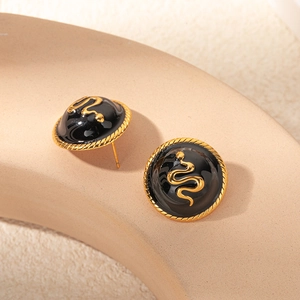 Boucles d'oreilles vintage avec disque gris, serpent doré et bordure torsadée