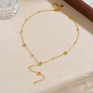 Elegant gold plated stainless steel necklace with hollow flower charms and tassel chain