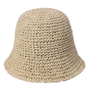 Minimalist beige handmade woven straw bucket hat with textured crochet pattern for women