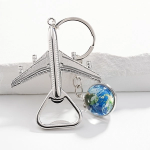 Silver metal airplane keychain with built-in bottle opener and colorful globe pendant