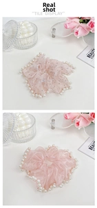Detail of Korean style scrunchies with white pearl trim and shimmering pink mesh fabric