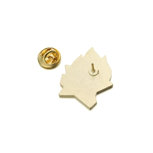 Detail of the golden metal pin back structure and butterfly clutch on the star badge
