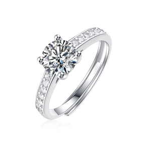 Detailed view of silver ring with round-cut moissanite and pave-set diamond band
