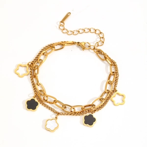 Bracciale a doppio strato in acciaio dorato con ciondoli a fiori neri e traforati