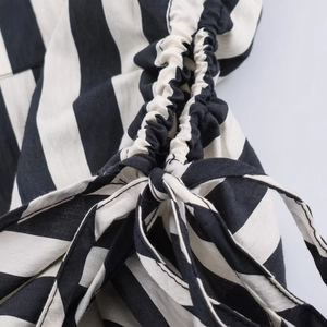 Detailed macro view of black and white striped fabric with drawstring tie design